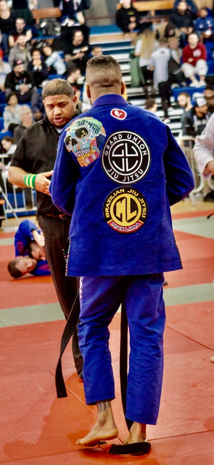 BJJ UNION competitor in the blue gi at a tournament