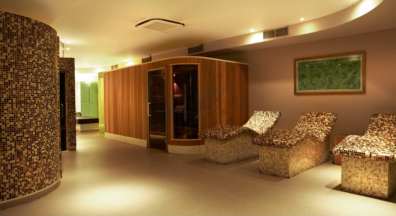 The spa: heated mosaic loungers in front of the sauna